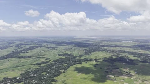 Sunlit Patchwork of Villages and Fields Under Puffy Sky Stock Footage 344271865