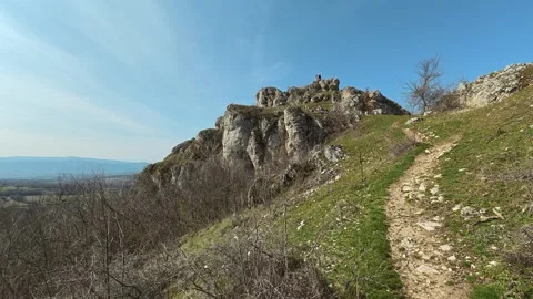 Sunlit path winds up grassy hill. Mount Rtanj Area, Serbia Stock Footage 331107274