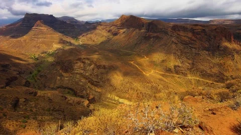 Sunlit Ravine: Cinematic Mountain Time-Lapse of Shifting Clouds over Barranco Stock Footage 340921447