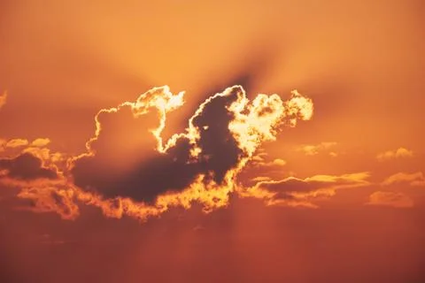 Sunlit red sky and cloud Stock Photos