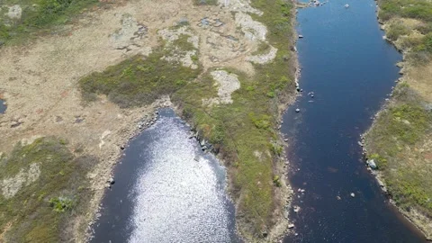 Sunlit Reflections: Top-Down Drone Flight Over Calm Water Stock Footage 253471293