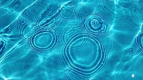 Sunlit Ripples in Serene Blue Pool Stock Footage 261162424