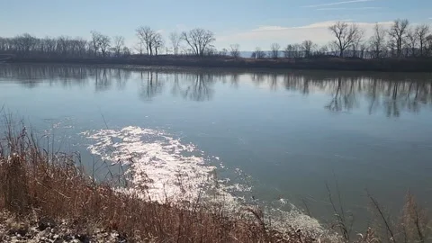 Sunlit River Eddy With Sparkling Reflections and Slow Swirling Water Stock Footage 330220488