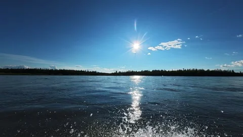 Sunlit River Landscape with Forested Horizon 库存影片 341404599