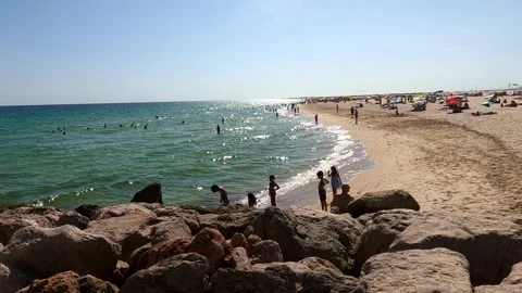 Sunlit Rock Beach on a Clear Day in Portugal Stock Footage 284767944