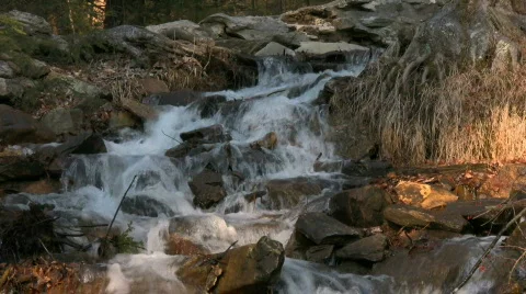 Sunlit Rocky Stream Stock Footage 844454