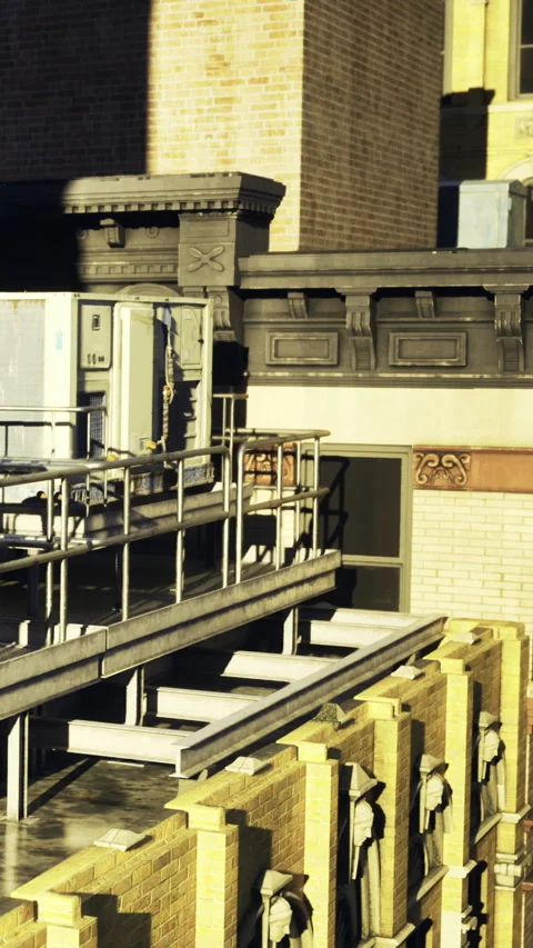 Sunlit rooftop scene showcasing architectural details and industrial elements Stock Footage 331695638