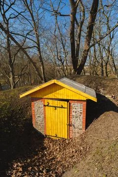 Sunlit Rural Storage Structure Nestled Among Autumn Landscape Trees Stock Photos