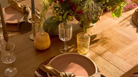 Sunlit Rustic Dining Table with Elegant Place Settings Video stock 340398508