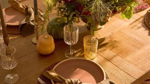 Sunlit Rustic Dining Table with Staged Place Settings Stock Footage 340398593