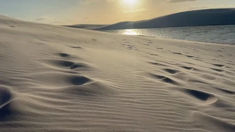 Sunlit Sand Ripples and Lagoon Edge in Lençóis Maranhenses Stock Footage 342443100