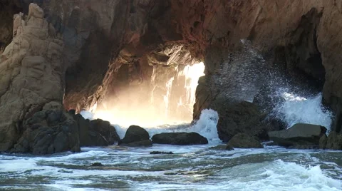 Sunlit sea cave with waves Stock Footage