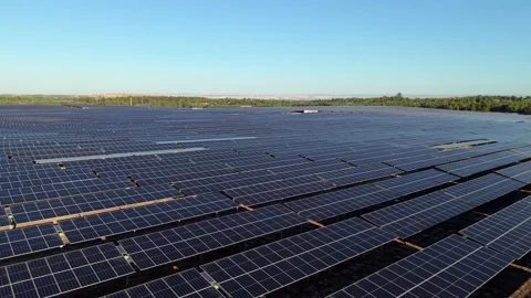 Sunlit solar panels in orderly rows Video stock 346061748