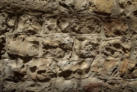 Sunlit stone wall background 스톡 사진