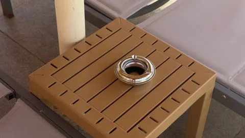 Sunlit Terrace Corner With Seating. Empty Outdoor Table Featuring Metal Ashtray Vidéo 337939194