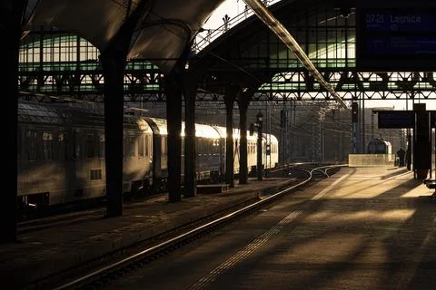 Sunlit train platform at golden hour Stock Photos