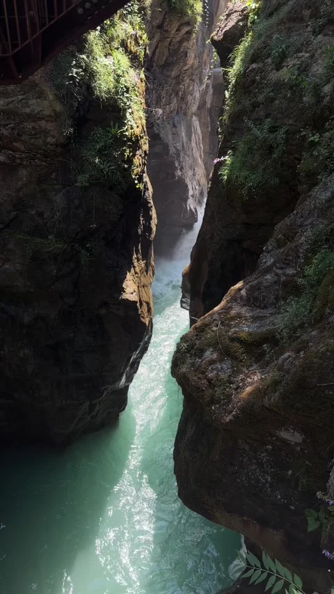 Sunlit Turquoise River and Waterfall in Deep Canyon Gorge 스톡 동영상 346589377