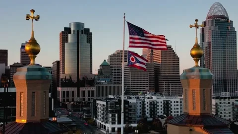 Sunlit US and Ohio flag on Roebling bridge in Cincinnati, USA - orbit, Stock Footage 219980367