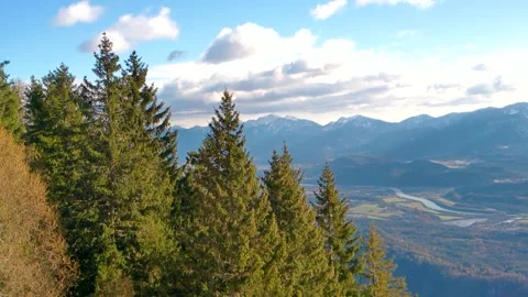 Sunlit valley small town in austria with mountains in the background Stock Footage 256647894