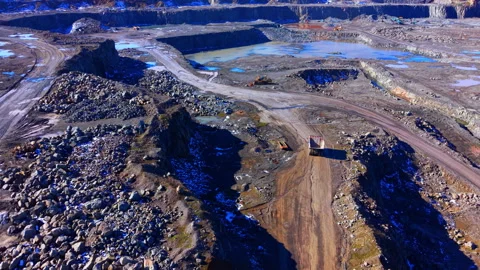 Sunlit view of quarry landscape with mining machinery, Bulgaria Stock Footage 339011589