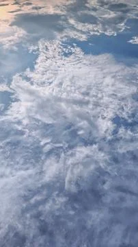 Sunlit White Clouds in Bright Sky Background 스톡 사진