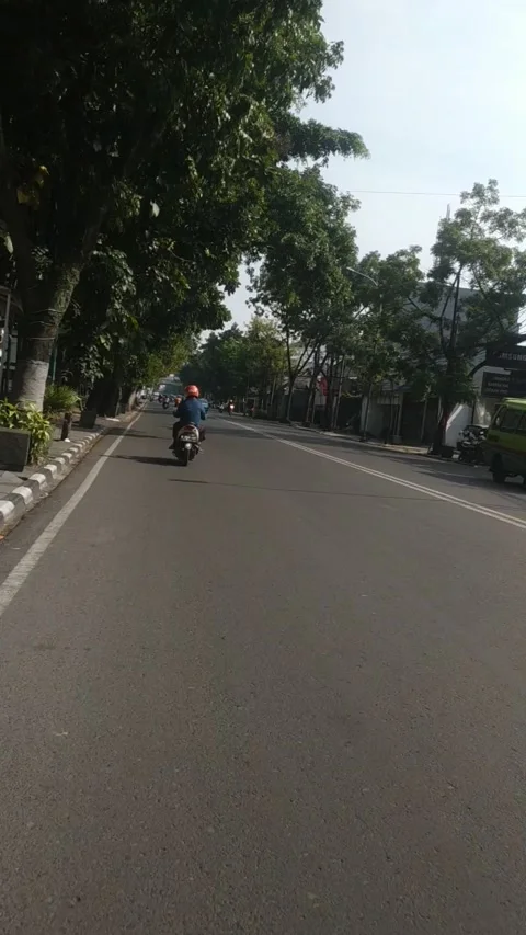 SUNMORI RIDING AT TOWN Stock Footage 243399567