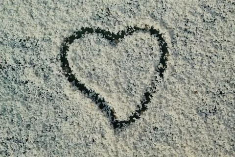 Sunned rice with heart shape Stock Photos