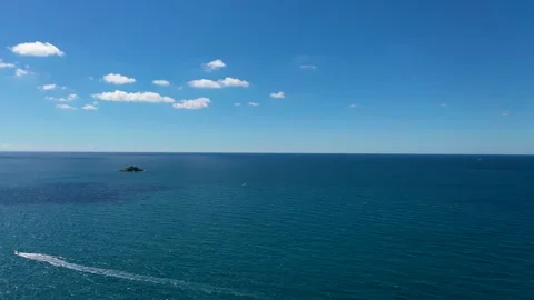 Sunning Deep Blue sea with clear blue sky and clouds Stock Footage 288817907