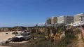 Sunny beach landscape city and cliffs panorama in Portimao Portugal 4k or 4k+ Resolution