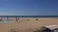 Sunny beach landscape pan with blue sky and harbor village in Portimao Portugal 4k or 4k+ Resolution