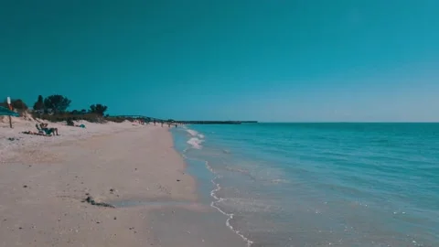 Sunny Beach Waves Blue Sky with Wave Action of Water on sand shore line Stock Footage 236804720