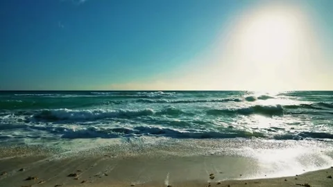 Sunny beach waves, clear ocean water, gentle shore break Stock Footage 310329591