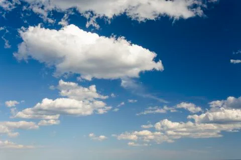 Sunny blue sky with clouds  in spring time . Stock Photos