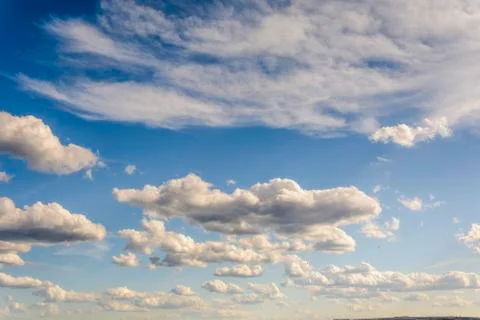Sunny blue sky with clouds  in spring time . Stock Photos