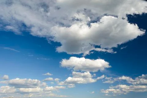Sunny blue sky with clouds  in spring time . Stock Photos