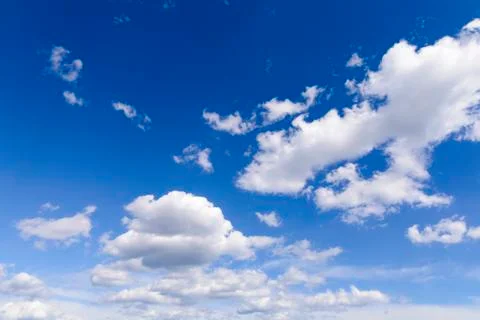 Sunny blue sky with clouds  in spring time . Stock Photos