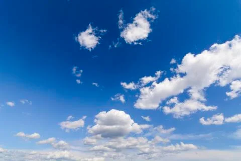 Sunny blue sky with clouds  in spring time . Stock Photos