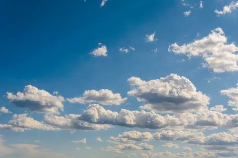 Sunny blue sky with clouds  in spring time . Stock Photos