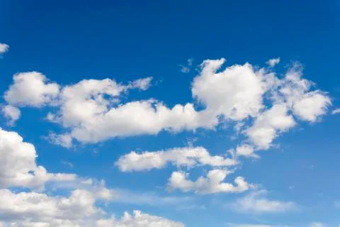 Sunny blue sky with clouds  in spring time . Stock Photos