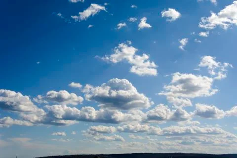 Sunny blue sky with clouds  in spring time . Stock Photos