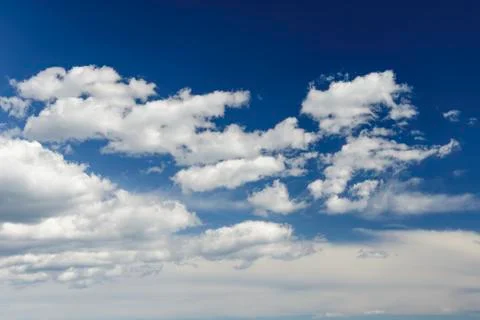Sunny blue sky with clouds  in spring time . Stock Photos