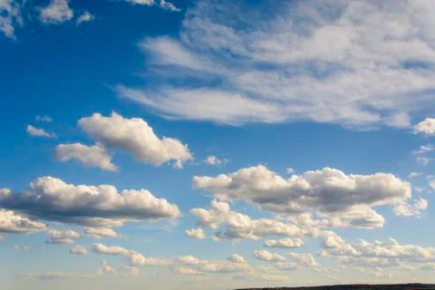 Sunny blue sky with clouds  in spring time . Stock Photos