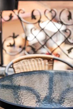 Sunny cafe terrace with empty table and bokeh effect. Stock Photos