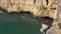 Sunny cliffs landscape pan at Algarve coastline Portugal 4k or 4k+ Resolution