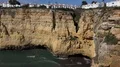 Sunny cliffs landscape pan at Algarve coastline Portugal 4k or 4k+ Resolution