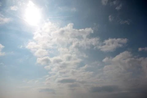 Sunny cloudy sky Stock Photos