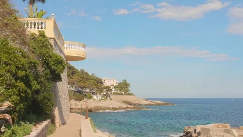 Sunny Coastal Path and Mediterranean Sea View at Cap d'Ail, French Riviera Stock Footage 345112629