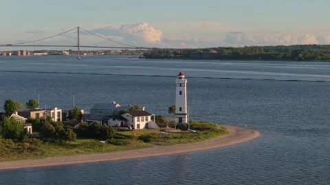 Sunny Danish Coast Capturing Strib Lighthouse with the New Little Belt Bridge Stock Footage 346747271