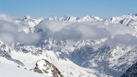 Sunny Day Above Low Clouds in Winter Snowy Alps Mountains Time Lapse Stock Footage 71348116
