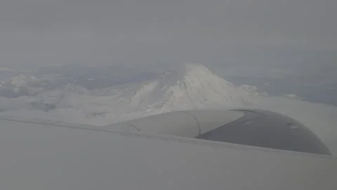 Sunny day airplane flight by Mt.Rainner Stock Footage 341701460